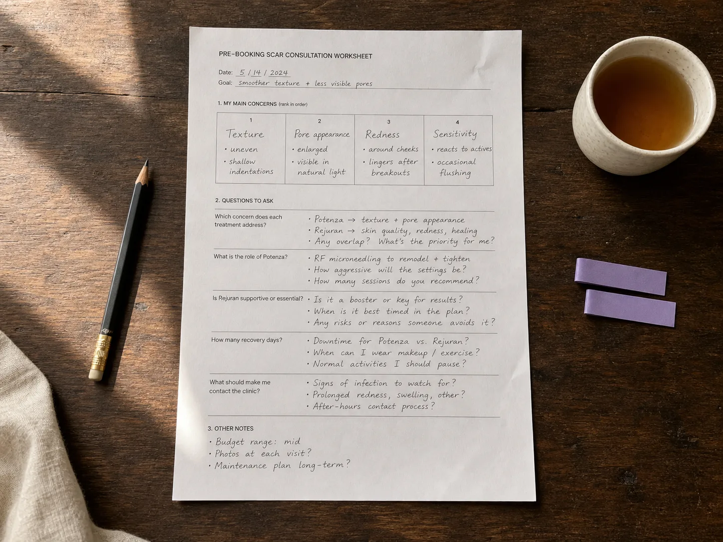 Filled acne scar consultation question worksheet with pencil and tea on a wooden home desk